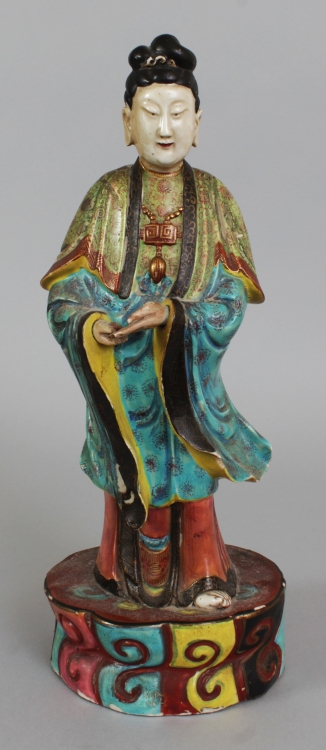 A 19TH CENTURY CHINESE FAMILLE ROSE PORCELAIN FIGURE OF A FEMALE IMMORTAL, standing in elaborately