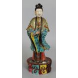 A 19TH CENTURY CHINESE FAMILLE ROSE PORCELAIN FIGURE OF A FEMALE IMMORTAL, standing in elaborately