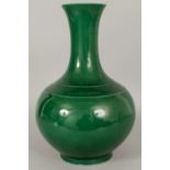 A GOOD LARGE 18TH/19TH CENTURY GREEN CRACKLEGLAZE BOTTLE VASE, the sides applied with a densely