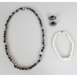 TWO LARGE CHINESE AGATE EYE BEADS & TWO NECKLACES, the beads 1.7in long. (4)