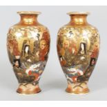 A MIRROR PAIR OF SIGNED JAPANESE SATSUMA EARTHENWARE VASES, circa 1900, each decorated with