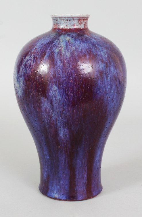 A GOOD QUALITY CHINESE FLAMBE GLAZED MEIPING PORCELAIN VASE, the sides applied with a streaked