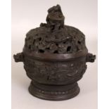 A CHINESE CIRCULAR BRONZE CENSER & COVER, weighing 2.7Kg, the pierced cover with dragons amidst