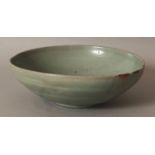 A 13TH CENTURY KOREAN KORYO DYNASTY CELADON BOWL, the rim with Japanese gold lacquer repairs, 7.