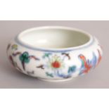A CHINESE MING STYLE DOUCAI PORCELAIN BRUSHWASHER, the base with a six character mark, 4.2in wide at