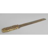 A SIGNED JAPANESE MEIJI PERIOD MIXED METAL PAGE TURNER, the handle decorated in cast and copper