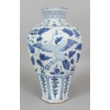 A LARGE CHINESE YUAN STYLE BLUE & WHITE PORCELAIN VASE, of octagonal section, the sides decorated