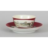 A CHINESE YONGZHENG PERIOD RUBY RED GROUND FAMILLE ROSE PORCELAIN TEABOWL & SAUCER, each piece
