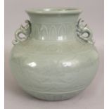 A CHINESE MOULDED CELADON PORCELAIN VASE, the sides moulded underneath the glaze with pairs of