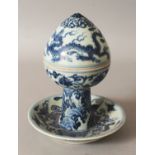 AN UNUSUAL CHINESE YUAN STYLE BLUE & WHITE PORCELAIN BOWL & COVER, supported on a dish-form base and