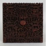 A 19TH CENTURY CHINESE CANTON CARVED SANDALWOOD PANEL, carved in deep relief with diminutive figures