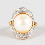 A GOOD LARGE PEARL AND DIAMOND RING in 18ct yellow gold.