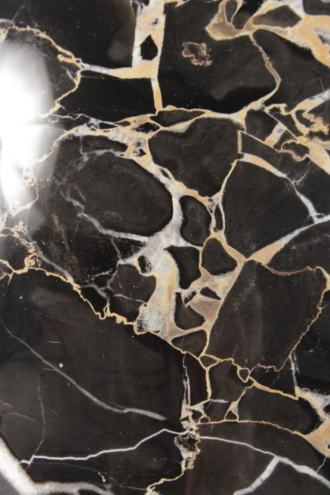 A LARGE BLACK AND GOLD MARBLE VASE. 17ins high. - Image 2 of 4