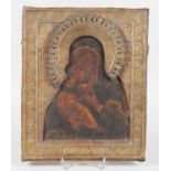 AN EARLY 18TH CENTURY RUSSIAN ICON, MOTHER AND CHILD, with brass surround. Inscribed many labels