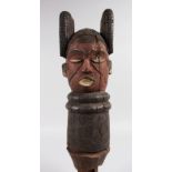 A LARGE CARVED WOOD TRIBAL HEAD. 20ins long.