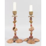 AN UNUSUAL PAIR OF 19TH CENTURY COLD PAINTED "SHELL" CANDLESTICKS.