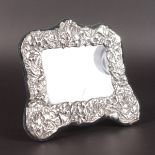 A FLORAL RECTANGULAR PHOTOGRAPH FRAME. 8ins x 9ins.