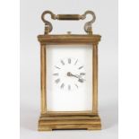 A 19TH CENTURY FRENCH REPEATER BRASS CARRIAGE CLOCK 5ins high.