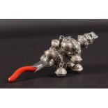 A BABIES SILVER AND CORAL RATTLE.