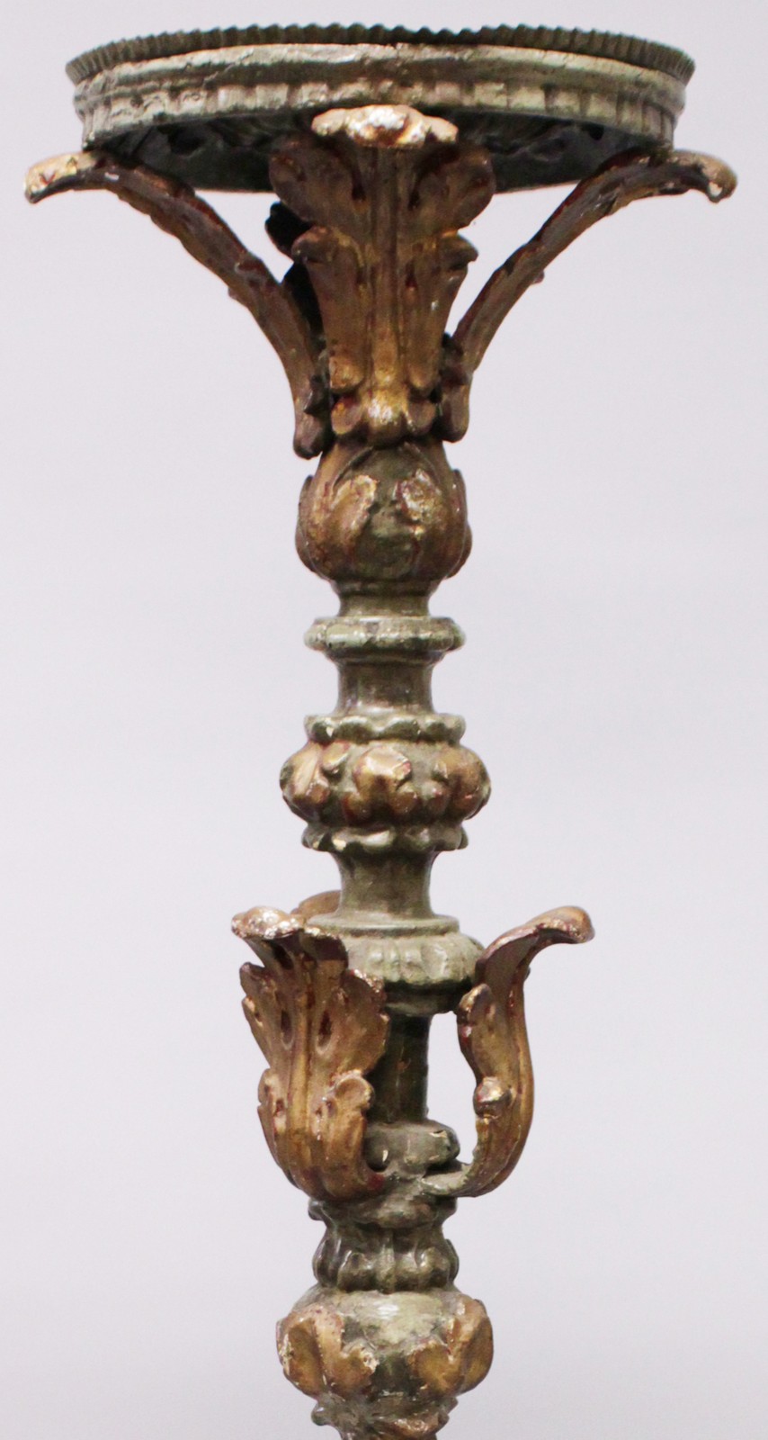 AN EARLY CARVED AND PAINTED PRICKET FLOOR STANDING CANDLESTICK, with circular top, leaf carved - Image 2 of 3