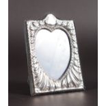 A SMALL HEART SHAPED PHOTOGRAPH FRAME. 5ins x 3ins.