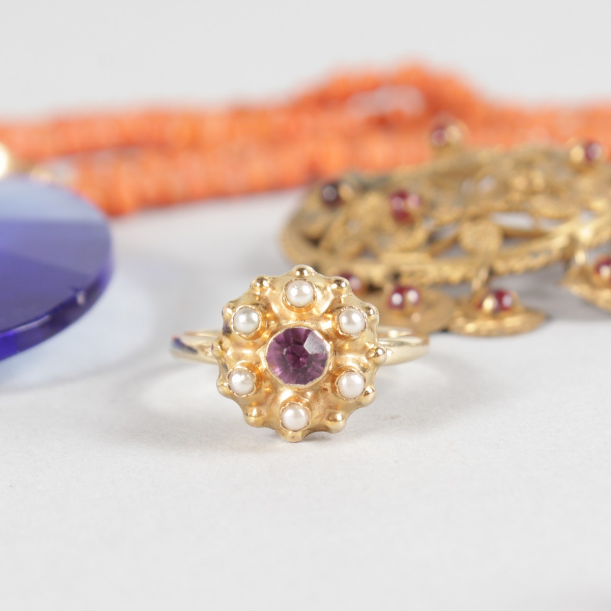 A FILIGREE BROOCH, three fobs, coral necklace, gold ring and pair of earrings. - Image 3 of 5