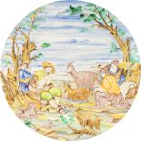 A LARGE MAJOLICA CIRCULAR PLAQUE with Istoriato decoration, "The Encampment" with figures, goats and