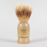 A RHINO HORN HANDLE SHAVING BRUSH.