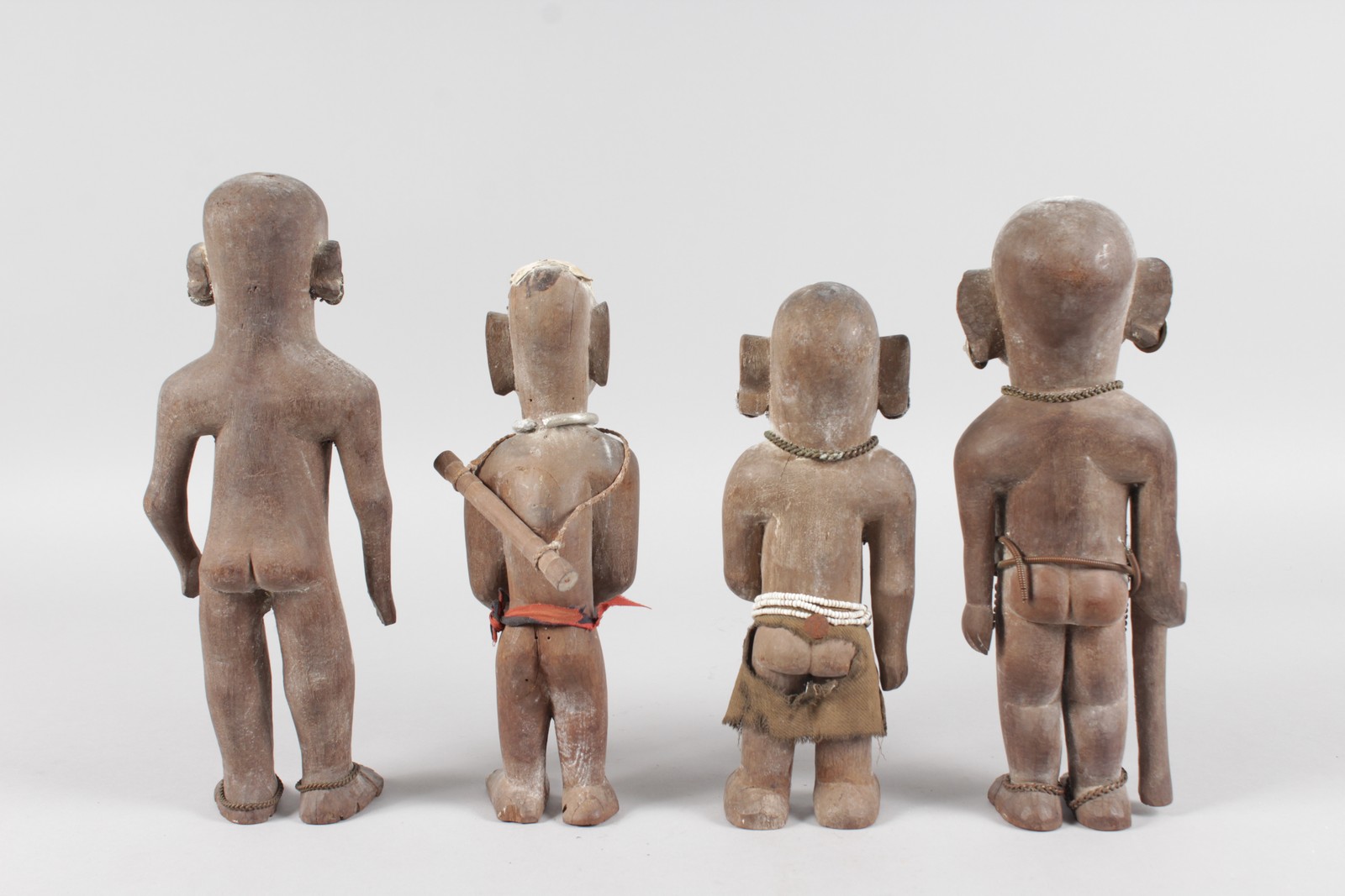 A SET OF FOUR ETHNIC CARVED WOOD TRIBAL FIGURES, some with original beadwork, 11ins high (2) and - Image 6 of 6