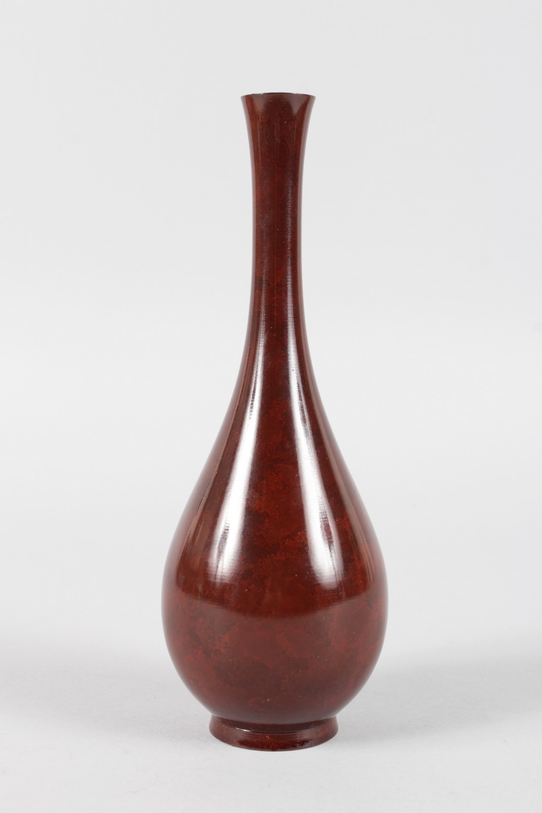 A SMALL SANG DE BOEUF BOTTLE VASE, POSSIBLY FINNISH. 8.5ins high.