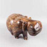 A LARGE AFRICAN CARVED WOOD HIPPOPOTAMUS. 17ins long.