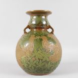 A LARGE BRONZE POTTERY TWO HANDLED VASE decorated with doves and trailing flowers. 13.5ins high.