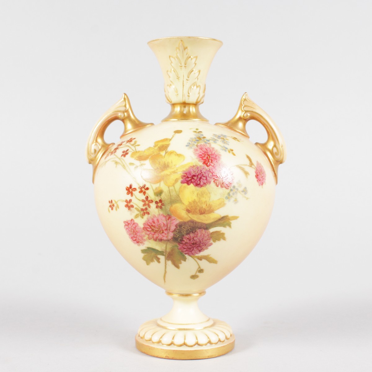 A ROYAL WORCESTER TWO HANDLED BLUSH IVORY VASE, painted with flowers, shape 2249, date code for