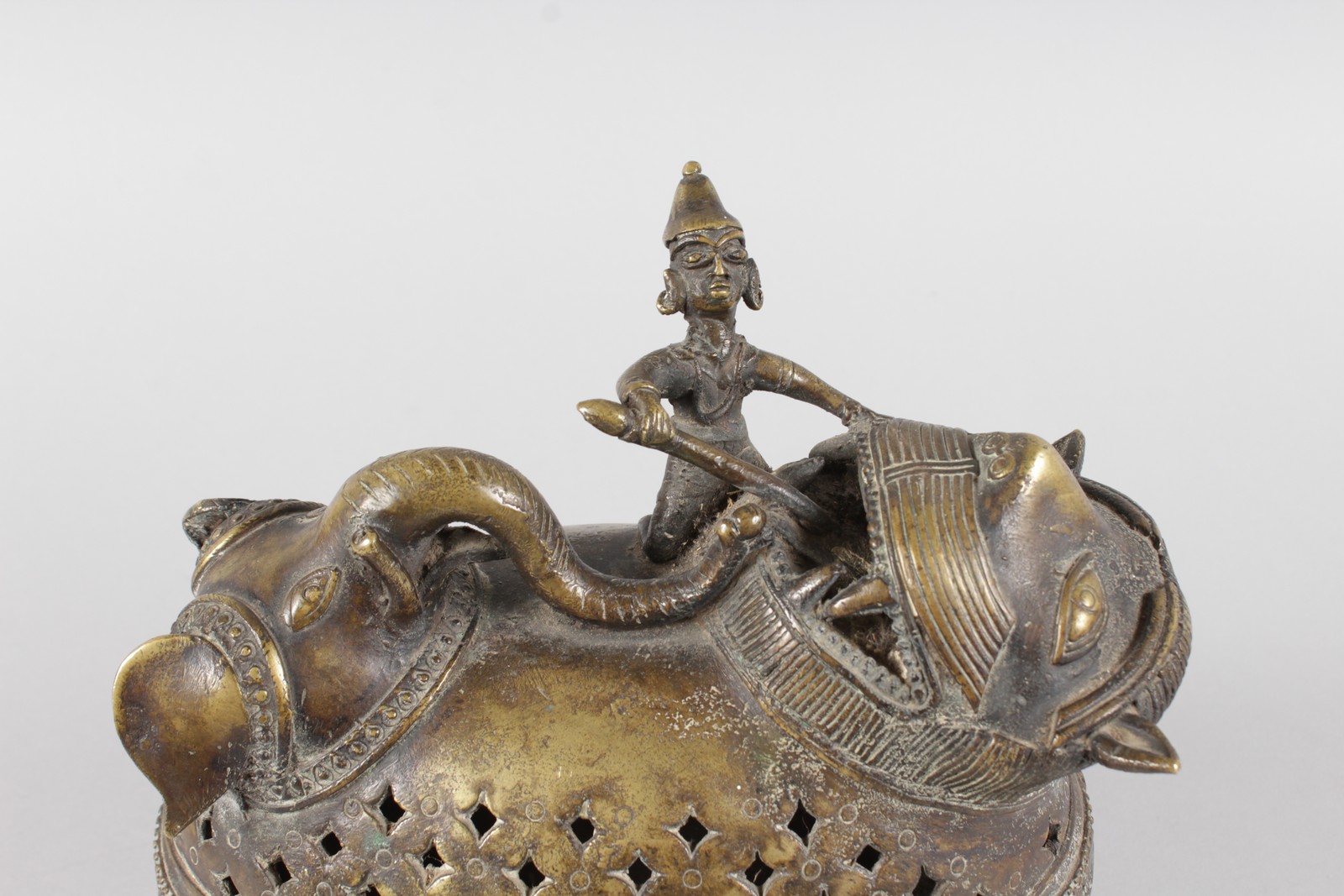 AN ISLAMIC BRONZE ELEPHANT AND GROTESQUE FIGURE VESSEL with pierced sides. 9ins long. - Image 2 of 3