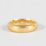 A 22CT YELLOW GOLD WEDDING BAND.