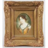 A GILT FRAMED MINIATURE of a lady in an orange dress.