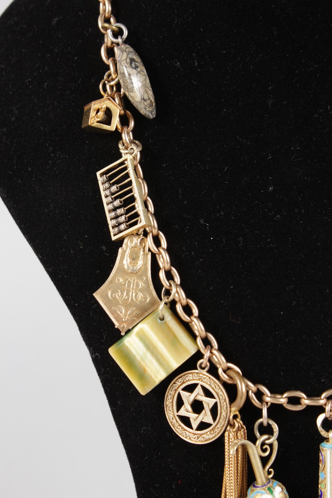 A LONG 9CT GOLD CHARM NECKLACE, some charms Jewish and Russian. - Image 3 of 4