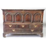 AN 18TH CENTURY OAK MARRIAGE CHEST, with rising top over four arched fielded panels, five drawers,