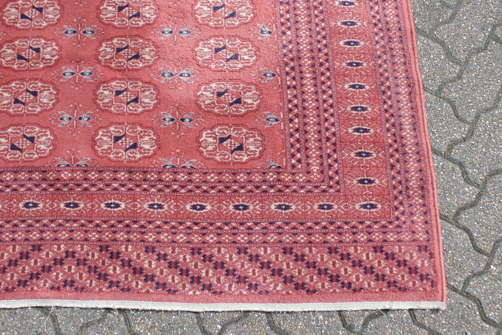 A BOKHARA CARPET, claret ground within lozenge border. 7ft 7ins x 5ft 5ins. - Image 3 of 4