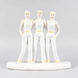 AN ART DECO DESIGN YELLOW AND WHITE GROUP OF THREE GIRLS. 12ins high.