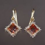 A PAIR OF 9CT GOLD, TOPAZ AND DIAMOND DROP EARRINGS.