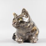 A CROUCHING POTTERY CAT by WINSTANLEY. 11ins.