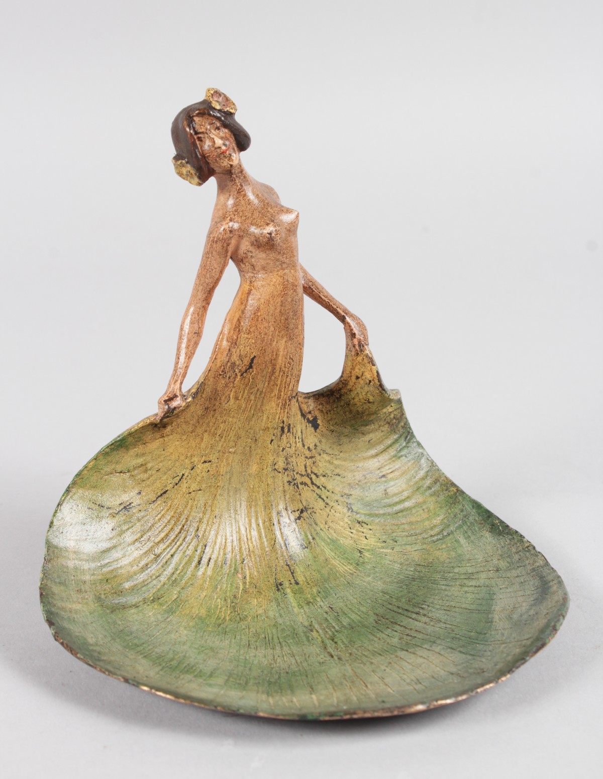 A GOOD PAINTED COLD CAST GROUP, ART NOUVEAU LADY, her dress as a tray. 5.5ins high.