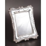 AN UPRIGHT CLASSIC PHOTOGRAPH FRAME with ribbon. 8ins x 5.5ins.