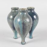 A SMALL INTERESTING TRIPLE BOTTLE VASE. 4ins high.