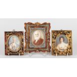 THREE MINIATURES, two of ladies, one of a bearded man, all in brass inlaid tortoiseshell frames.