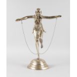 A LARGE ART DECO SILVERED DANCER on one leg, on a circular stepped base. 20ins high.