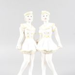 AN ART DECO DESIGN YELLOW AND WHITE GROUP OF TWO GIRLS. 12ins high.