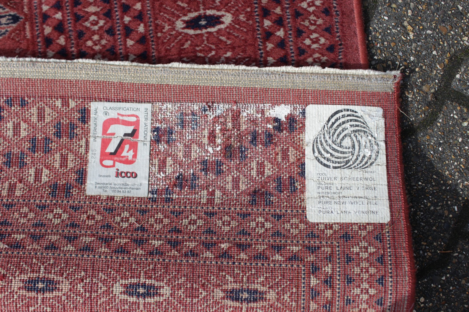 A BOKHARA CARPET, claret ground within lozenge border. 7ft 7ins x 5ft 5ins. - Image 4 of 4