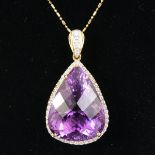 AN IMPRESSIVE PEAR SHAPED AMETHYST PENDANT of 36CTS, surrounded by a carat of diamonds in 18ct